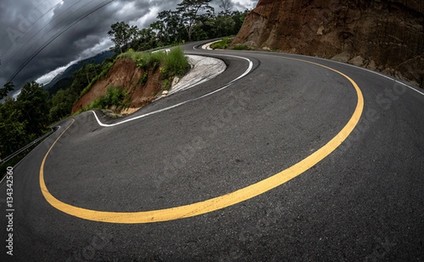 Fototapeta Amazing sharp bend, abrupt turn, winding, serpentine and circuitous route, mountain asphalt road with curve and yellow line