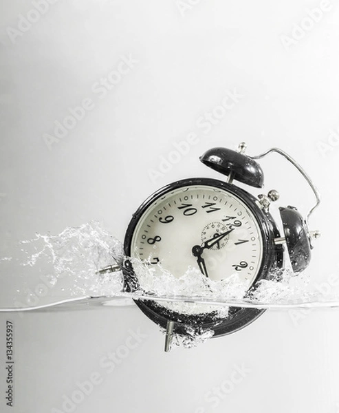 Fototapeta Drowning clock in the water