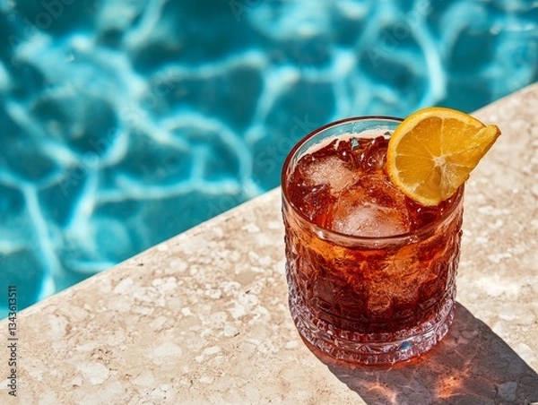 Fototapeta Refreshing Cocktail by the Pool: A Taste of Summer Indulgence with Citrus Burst and Icy Chill