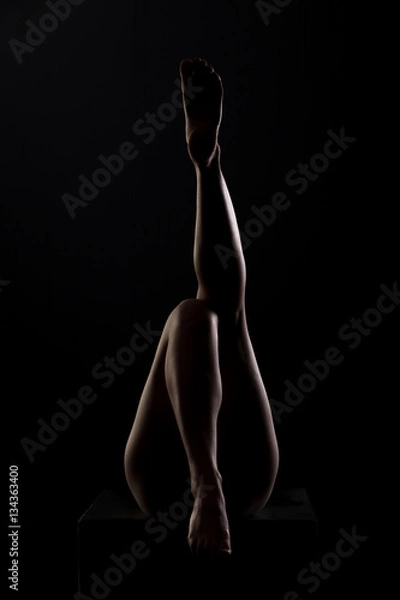 Obraz silhouette of female priests and feet at studio