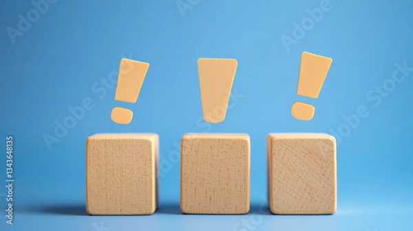 Fototapeta Three exclamation marks hover over wooden blocks, representing important issues needing attention.