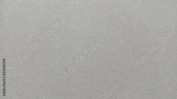 Fototapeta close-up view of a gray recycled paper texture with a rough and fibrous surface. Ideal for backgrounds, design elements, and creative projects