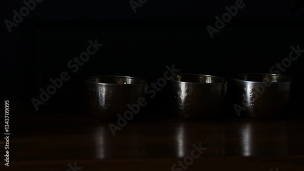 Obraz Dark background with three bowls