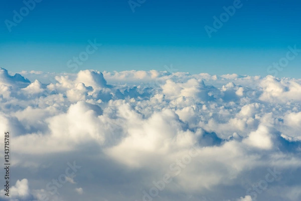 Fototapeta flight over the clouds. view of the clouds from the airplane window	