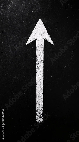 Fototapeta a tall white arrow pointing upward on a dark textured surface creating a bold visual navigation symbol with grit
