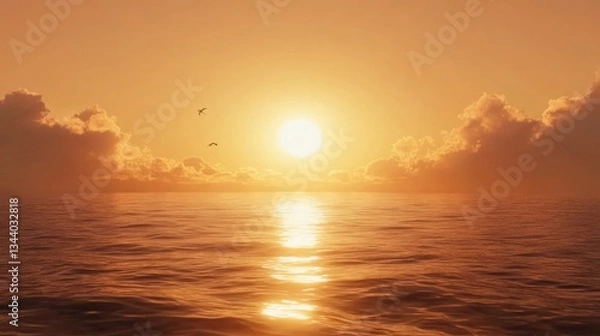 Fototapeta Golden sunset over the tranquil ocean with birds in flight.