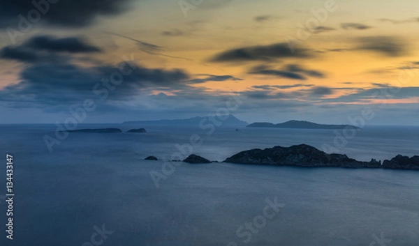 Fototapeta Long exposure Panoramic Seascape at dusk. View of the cliff into the sea and distant islands. Agios Stefanos cape. Afionas. Corfu. Greece.