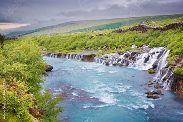 Fototapeta Hraunfossar - series of waterfalls formed by rivulets streaming over a distance of about 900 metres in Borgarfjörður, western Iceland