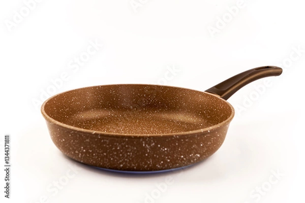 Fototapeta Metal frying pan:On white, wooden isolated background. Space for text.Ceramic non-stick coating: Kitchenware;Cooking food for chefs in the kitchen.Advertisement concept. Close-up
