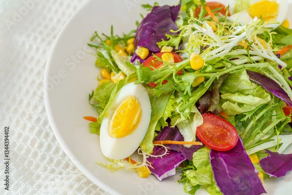 Fototapeta Mixed fruit and vegetable salad on a simple background