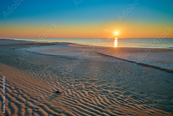 Fototapeta Sunrise over the Gulf of America at St. George Island Florida.