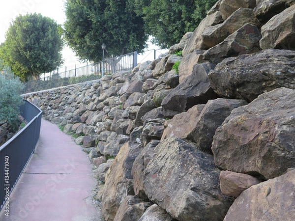 Obraz Retaining wall from rough granite blocks