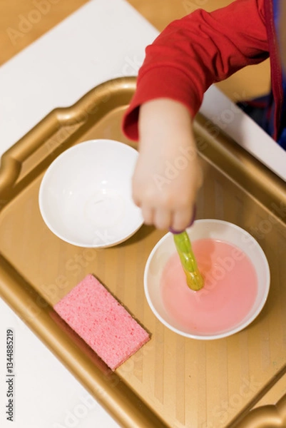 Fototapeta Child practicing fine motor skills