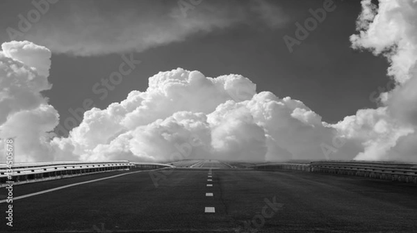 Obraz Free highway on a background of beautiful clouds. black and whit