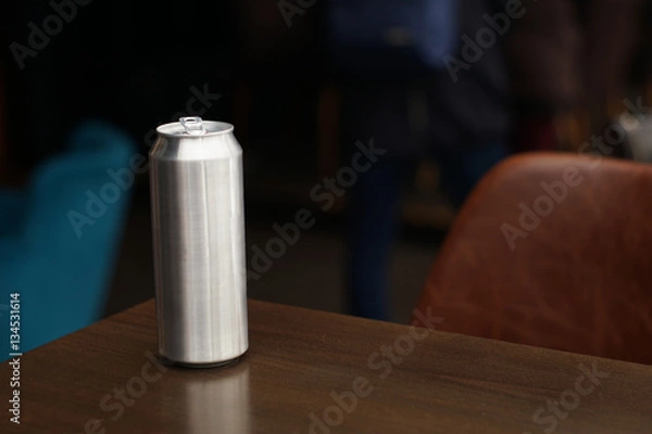 Fototapeta Empty can for beer without labels on the table