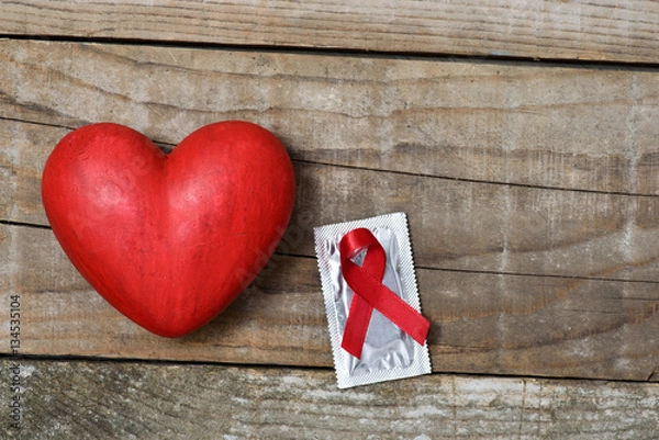 Obraz Protect the one you love - Hart condom and red ribbon