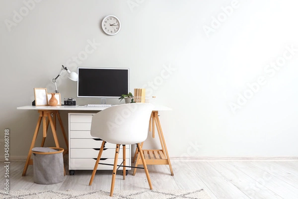 Fototapeta Stylish workplace with modern computer and photo camera near light wall