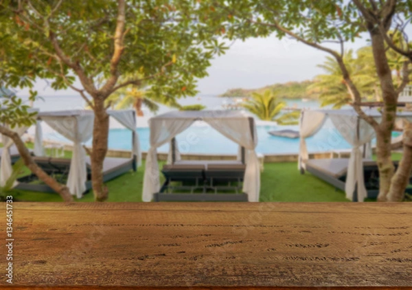 Obraz Wooden table top on the beach or sea. swimming pool Party on the beach  sunshine time concept.For montage product display or design key visual layout.View of copy space.