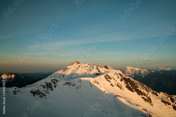 Obraz Snow-capped Caucasus Mountains at dawn, Sochi, Russia.