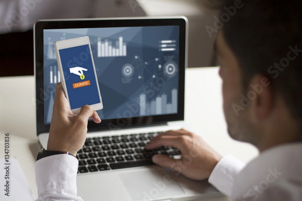 Fototapeta businessman donating  money with smartphone