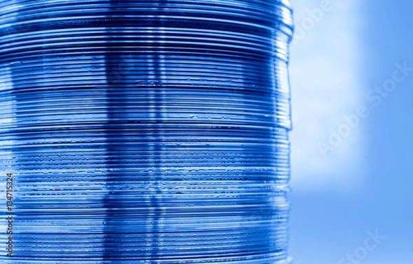 Fototapeta A column of DVDs in close up view