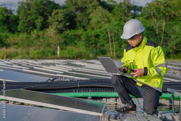 Fototapeta Asian engineer working at Floating solar power plant,Renewable energy,Technician and investor solar panels checking the panels at solar energy installation