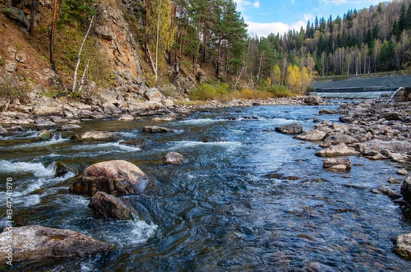 Obraz Southern Urals, a rapids on the mountain river Aigir. The reinforced river shore at the railway station.