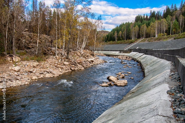 Obraz Southern Urals, a rapids on the mountain river Aigir. The reinforced river shore at the railway station.