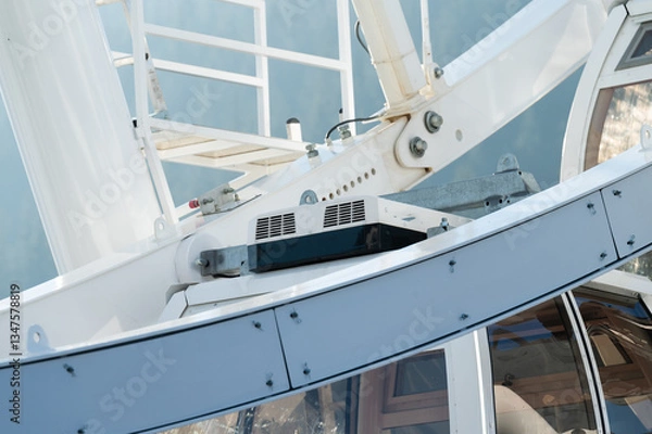 Fototapeta Exploring the mechanics of a towering ferris wheel as it spins gracefully under a bright sky