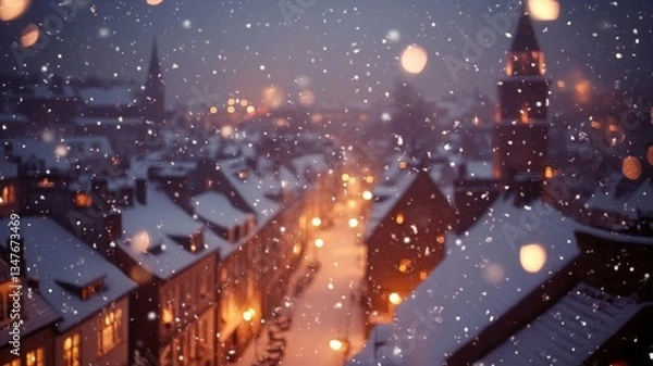 Obraz Snowfall over a charming snow covered town at night