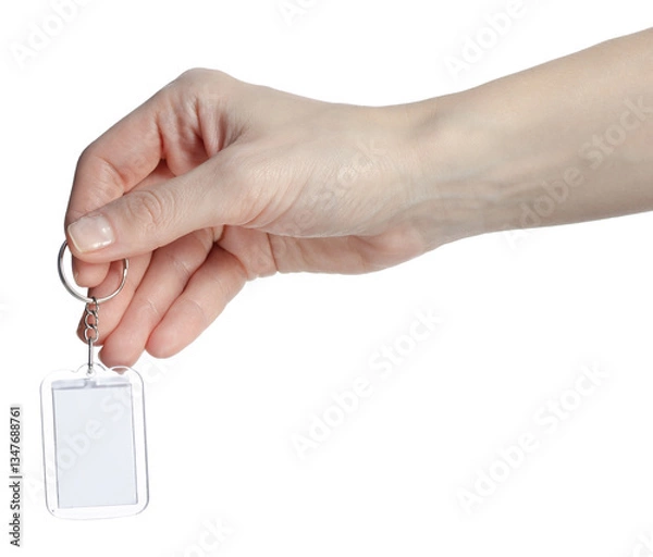 Fototapeta Keychain as a frame white space in hand on white background isolation