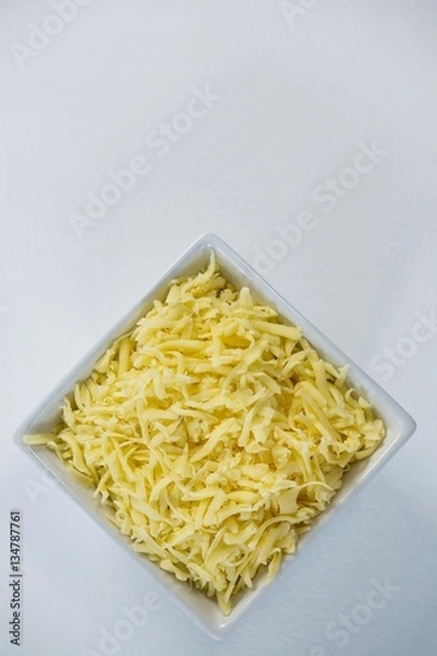 Obraz Bowl of grated cheese