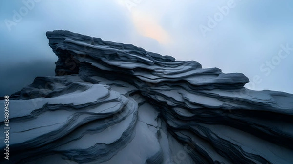 Obraz Dark Volcanic Rocks and Sand Under Dramatic Clouds
