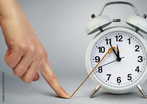 Obraz Hand stop time on alarm clock, deadline concept