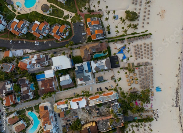 Obraz A beach with a town in the background