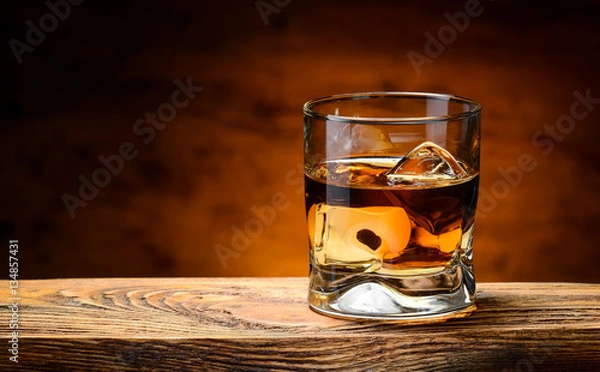 Obraz whiskey with ice on a wooden table