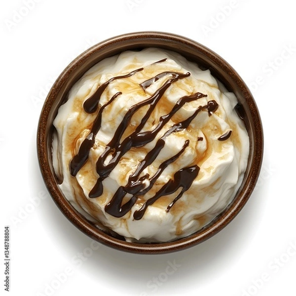 Fototapeta Overhead view of whipped cream with drizzles in a small bowl