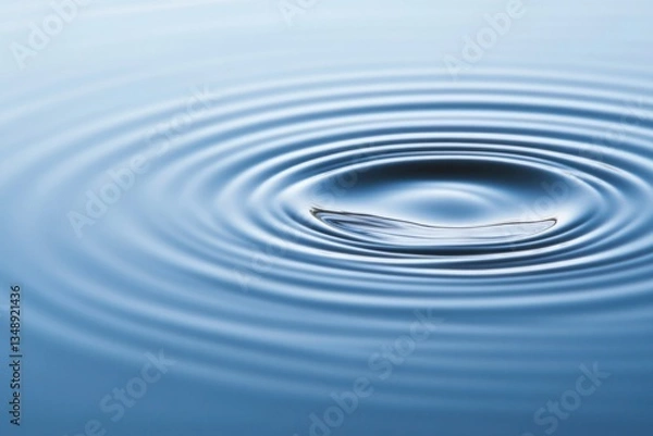 Fototapeta Calm water surface with concentric ripples creating serene atmos