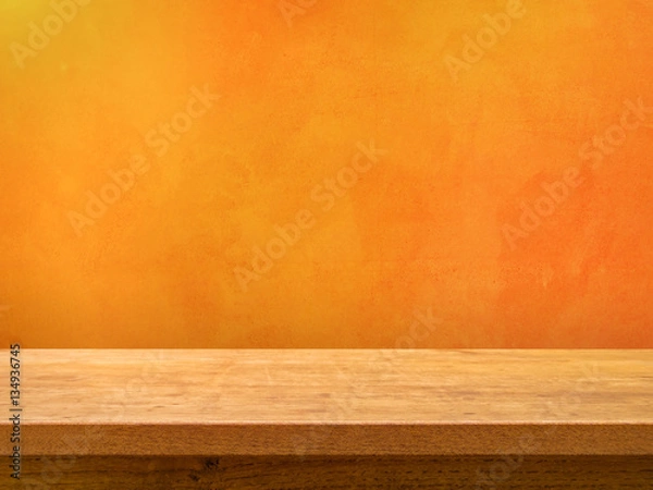 Fototapeta Empty wooden table on orange textured wall