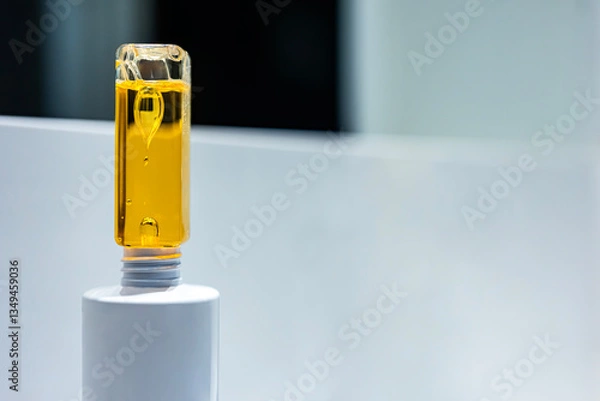 Fototapeta Drops inside a plastic bottle. Beautiful drops inside a yellow oily liquid.