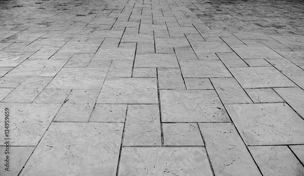 Fototapeta Perspective View of Monotone Grunge Cracked Gray Brick Marble Stone on The Ground for Street Road. Sidewalk, Driveway, Pavers, Pavement in Vintage Design Flooring Square Pattern Texture Background