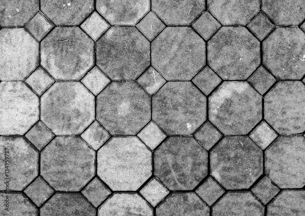Fototapeta Top View of Monotone Grunge Gray Brick Stone on The Ground for Street Road. Sidewalk, Driveway, Pavers, Pavement in Vintage Design Flooring Hexagon Pattern Texture Background