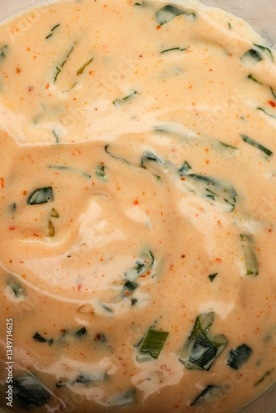Fototapeta Creamy Spiced Sauce with Fresh Herbs and Seasonings

