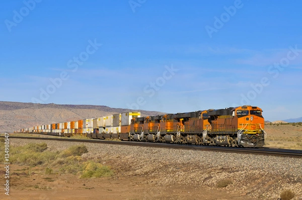 Fototapeta freight train loaded with containers