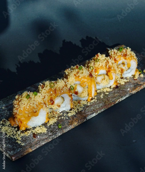 Fototapeta Sushi, japanese food, served on a wooden slate, sushi roll with salmon, cheese, caviar, shrimps, avocado, uramaki, California roll, Tempura roll, makizushi, Kappa Maki, Makizushi