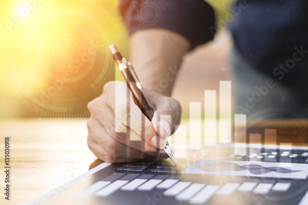 Fototapeta businessman hand working with new modern computer and business s