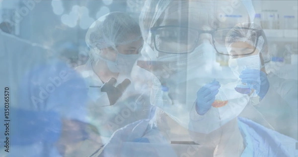 Obraz Scientists in laboratory wearing protective gear conducting research and experiments