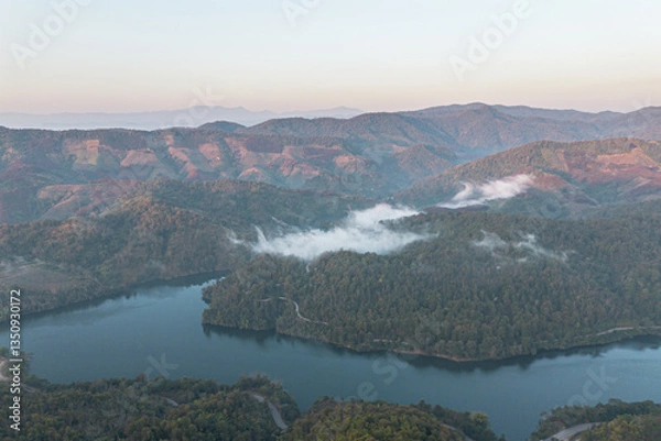 Fototapeta Mountain view on Doi Chang, Chiang Rai Province, northern Thailand at the beginning of the rainy season.