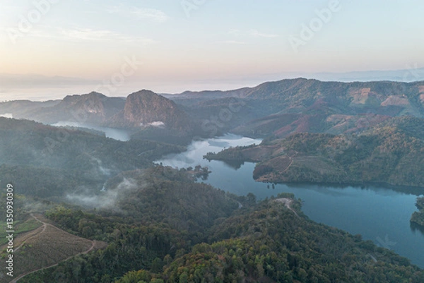 Fototapeta Mountain view on Doi Chang, Chiang Rai Province, northern Thailand at the beginning of the rainy season.