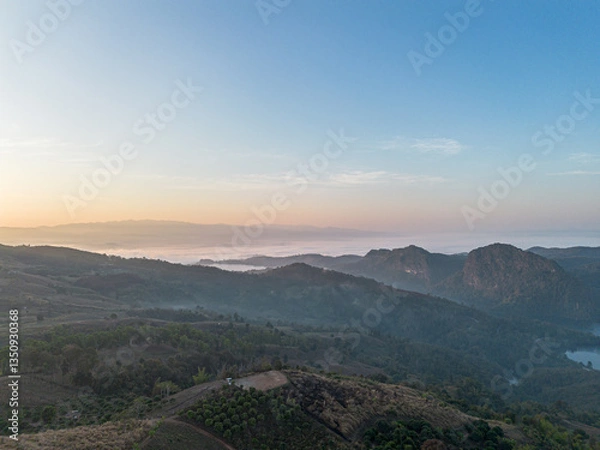 Fototapeta Mountain view on Doi Chang, Chiang Rai Province, northern Thailand at the beginning of the rainy season.